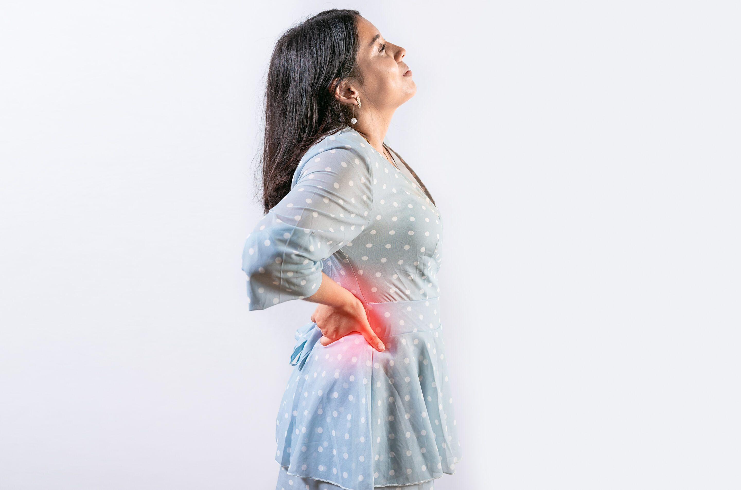 Suffering girl with back pain isolated. Young woman with spine problems isolated. Person with back pain. lumbar problems concept Endoscopic Spine Surgery ESS Columbia Asia Setapak